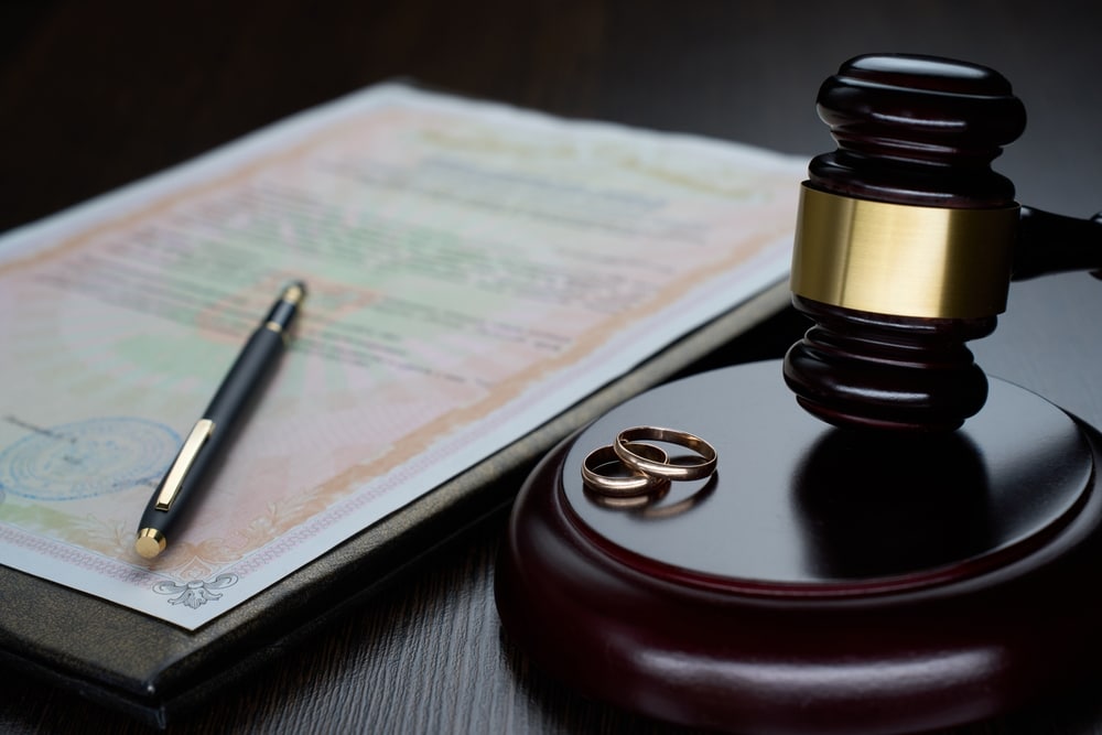 Judges hammer with Marriage rings